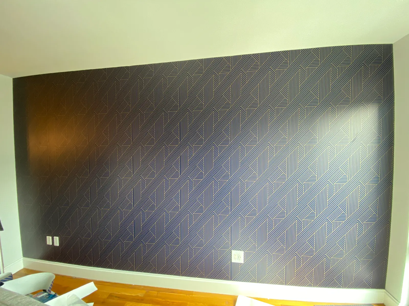 navy geometric peel & stick accent wall in a Brooklyn, NY living room