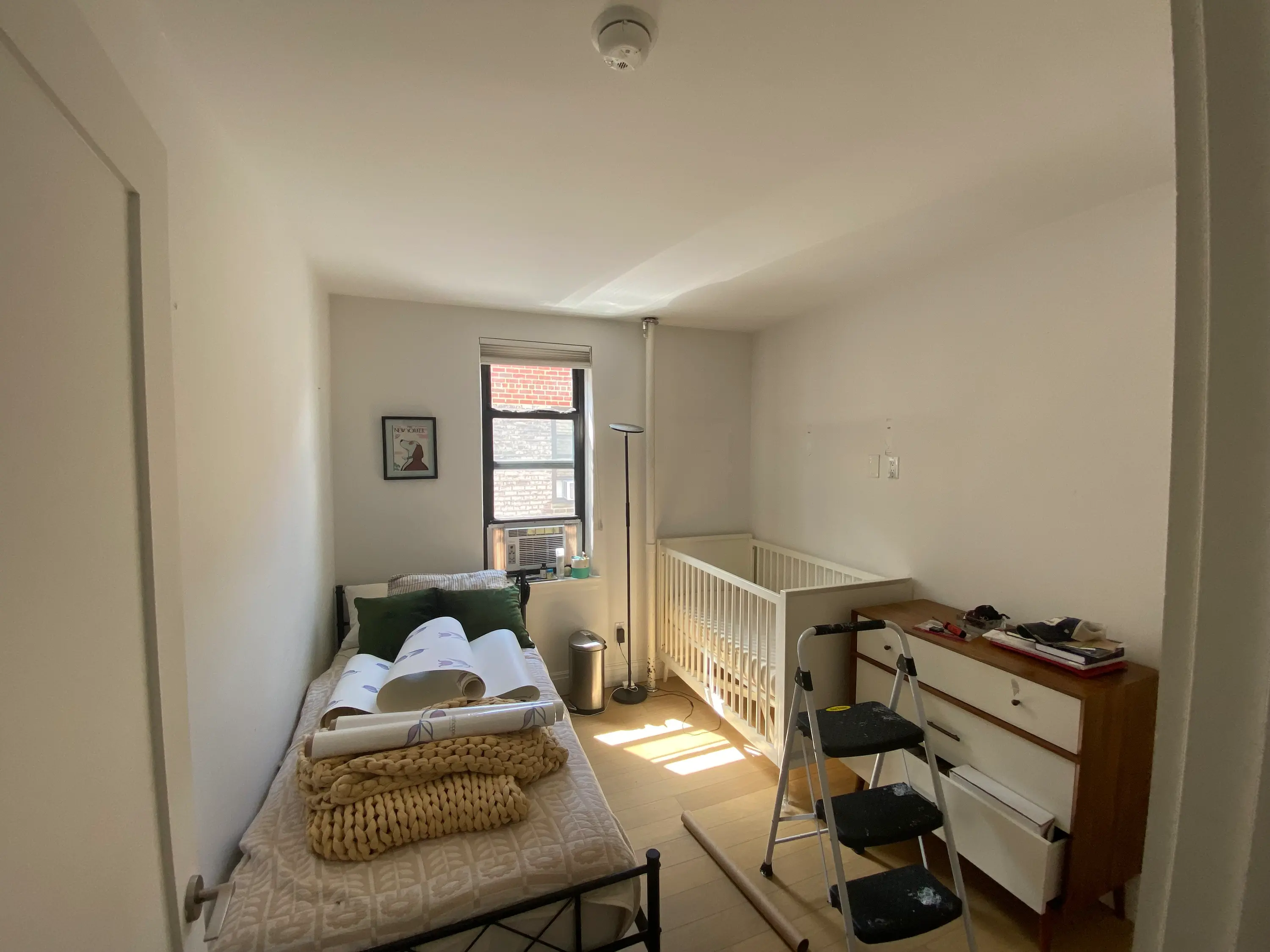 bare nursery walls in Upper Manhattan, NY before the tulip wallpaper